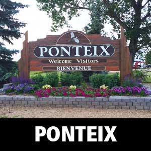 Thumbnail image for Age-Friendly Ponteix. Image is of Ponteix bilingual town sign, with flowerbed in front.