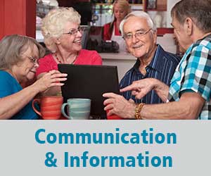 Thumbnail image for the Communication and Information Domain. Image is of two older women and two older men gathered around a laptop computer, smiling and chatting about what is on the screen.