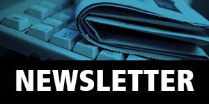 Image is a small thumbnail of a folded newspaper on a computer keyboard. The caption is Newsletter.