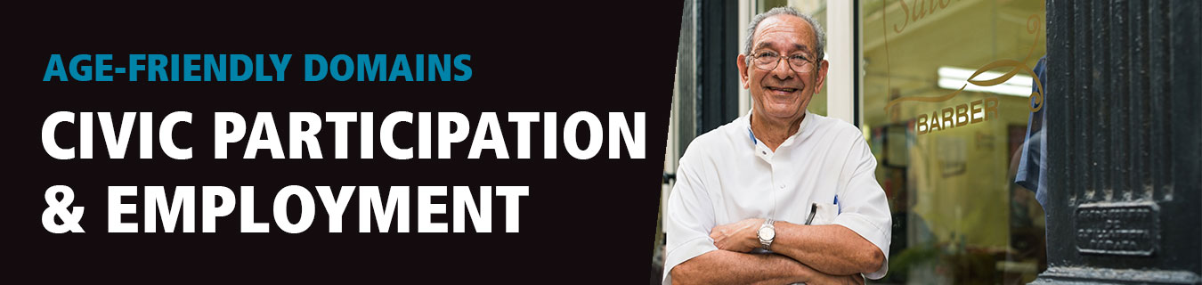 Banner image for Age-Friendly Civic Participation and Employment domain page. Left side has black background with the words Age-Friendly Domains above the words Civic Participation and Employment. On right side of banner is image of older male barber standing in front of his barber shop, arms folded, smiling.