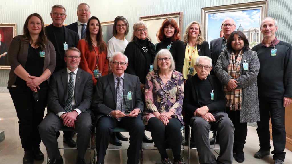 Photo of Age-Friendly Regina committee members, SSM representatives, and Saskatchewan government minister at presentation of Age-Friendly Recognition at Saskatchewan Legislature.